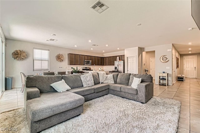 3716 W Colton Ave, North Las Vegas, NV 89032 - living room featuring light tile patterned flooring and recessed lighting