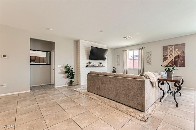 3716 W Colton Ave, North Las Vegas, NV 89032 - living area featuring light tile patterned floors and baseboards