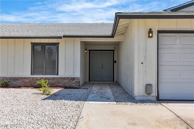 6204 Robin Hood Cir, Las Vegas, NV 89108 - doorway to property featuring a shingled roof and a garage