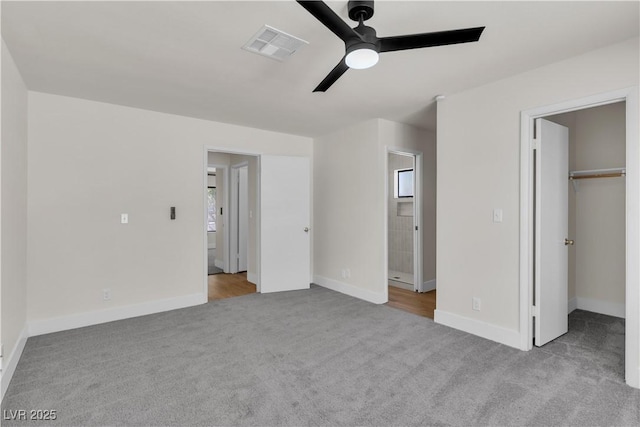 6204 Robin Hood Cir, Las Vegas, NV 89108 - unfurnished bedroom with carpet flooring, a spacious closet, baseboards, ceiling fan, and ensuite bath