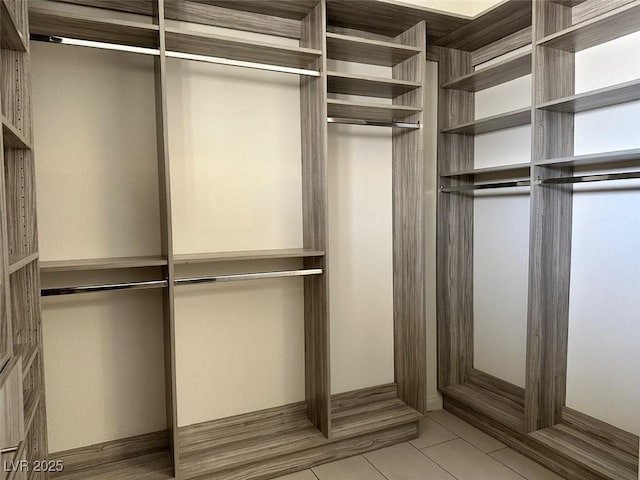 8931 Lansberry Ct, Las Vegas, NV 89147 - spacious closet featuring light tile patterned floors