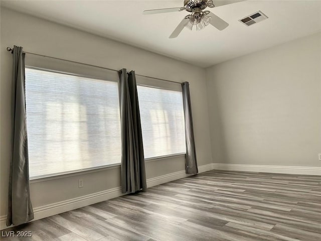 8931 Lansberry Ct, Las Vegas, NV 89147 - spare room with wood finished floors, baseboards, and ceiling fan