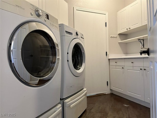 8931 Lansberry Ct, Las Vegas, NV 89147 - laundry room with cabinet space and washing machine and dryer