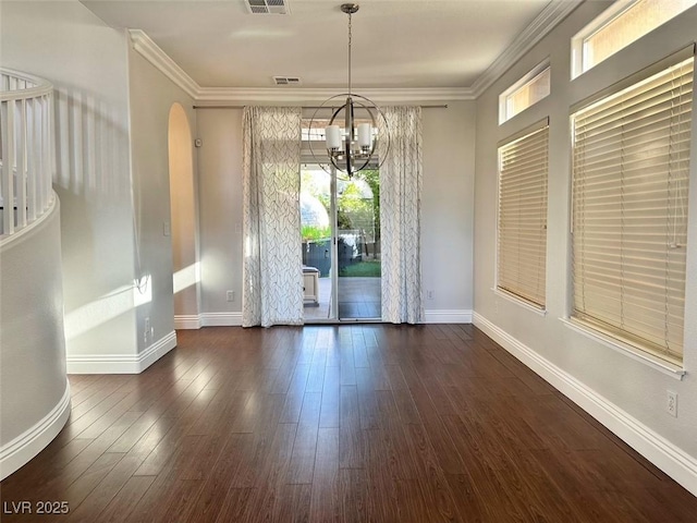 8931 Lansberry Ct, Las Vegas, NV 89147 - unfurnished dining area featuring a chandelier, baseboards, dark wood-style floors, arched walkways, and ornamental molding