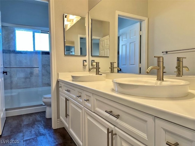 8931 Lansberry Ct, Las Vegas, NV 89147 - full bath featuring toilet, double vanity, and a stall shower