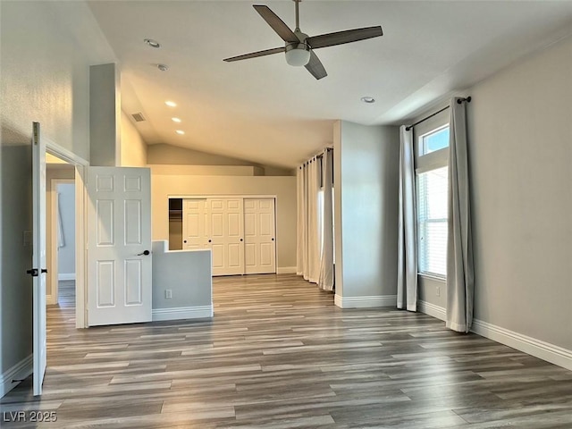 8931 Lansberry Ct, Las Vegas, NV 89147 - unfurnished living room with a ceiling fan, wood finished floors, vaulted ceiling, baseboards, and recessed lighting
