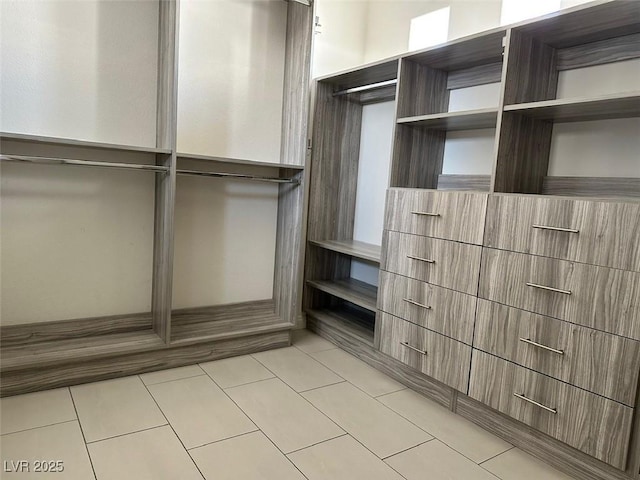 8931 Lansberry Ct, Las Vegas, NV 89147 - walk in closet with light tile patterned floors