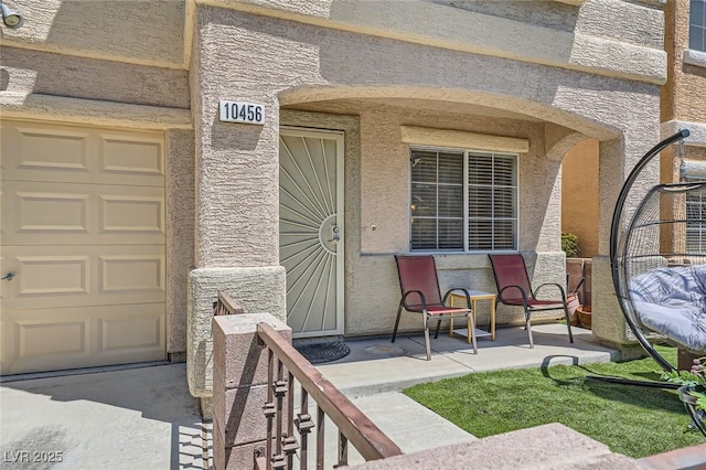 10456 Prairie Schooner Ave, Las Vegas, NV 89129 - view of exterior entry featuring stone siding and a garage