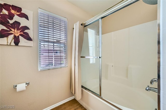 10456 Prairie Schooner Ave, Las Vegas, NV 89129 - full bathroom featuring enclosed tub / shower combo, baseboards, plenty of natural light, and wood finished floors