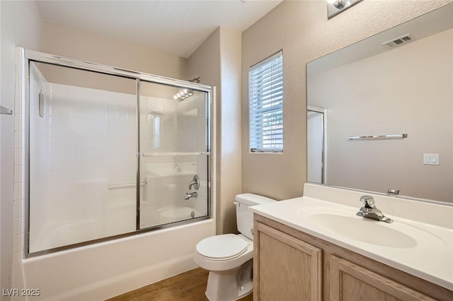 10456 Prairie Schooner Ave, Las Vegas, NV 89129 - full bath with toilet, vanity, shower / bath combination with glass door, and wood finished floors