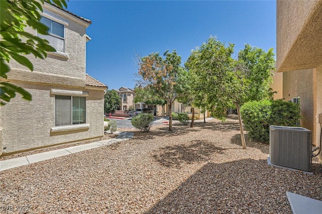 10456 Prairie Schooner Ave, Las Vegas, NV 89129 - view of yard featuring central AC unit and a residential view