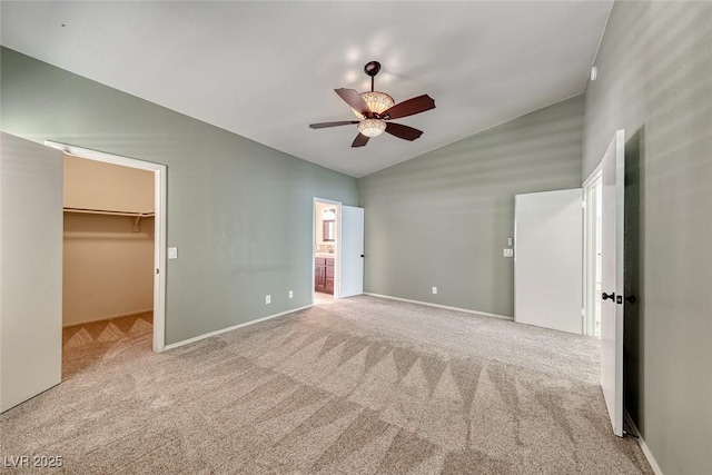 234 Geronimo Ct, Henderson, NV 89074 - unfurnished bedroom with a walk in closet, carpet, a ceiling fan, high vaulted ceiling, and ensuite bathroom