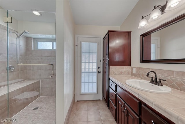 234 Geronimo Ct, Henderson, NV 89074 - bathroom featuring vanity, a shower stall, tile patterned floors, and tasteful backsplash