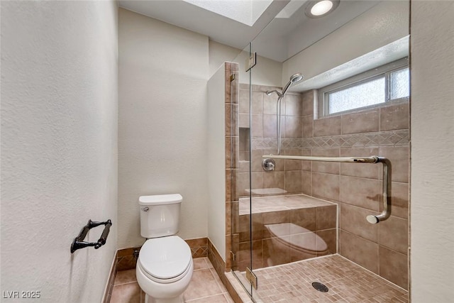 234 Geronimo Ct, Henderson, NV 89074 - full bathroom with tile patterned floors, a shower stall, and a textured wall