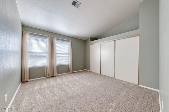 234 Geronimo Ct, Henderson, NV 89074 - unfurnished bedroom with carpet floors, vaulted ceiling, and a closet