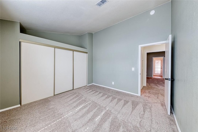 234 Geronimo Ct, Henderson, NV 89074 - unfurnished bedroom featuring vaulted ceiling, carpet, and a closet