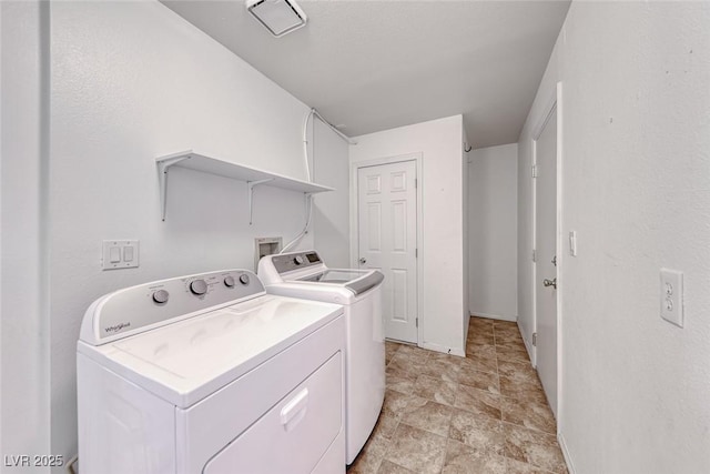 234 Geronimo Ct, Henderson, NV 89074 - laundry area with washer and clothes dryer and stone finish floors