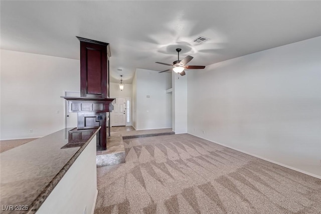234 Geronimo Ct, Henderson, NV 89074 - unfurnished living room featuring light carpet and a ceiling fan