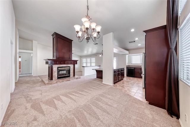 234 Geronimo Ct, Henderson, NV 89074 - unfurnished living room with light carpet, a chandelier, plenty of natural light, a high end fireplace, and recessed lighting