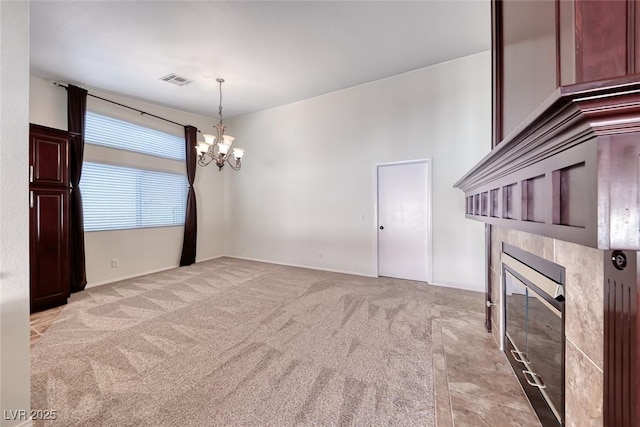 234 Geronimo Ct, Henderson, NV 89074 - unfurnished room with a fireplace, a chandelier, and light carpet