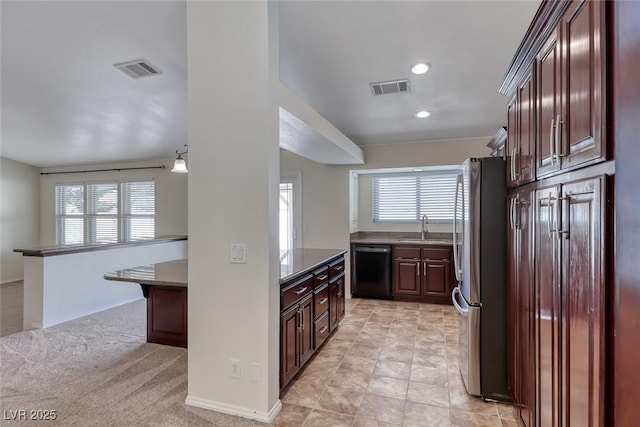 234 Geronimo Ct, Henderson, NV 89074 - kitchen with freestanding refrigerator, dishwasher, plenty of natural light, recessed lighting, and dark brown cabinetry