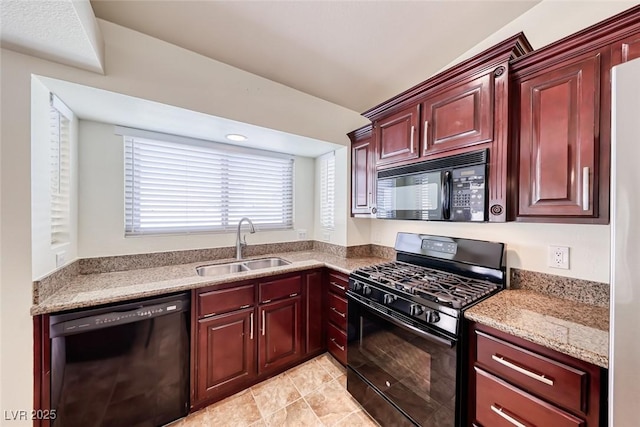 234 Geronimo Ct, Henderson, NV 89074 - kitchen featuring black appliances, reddish brown cabinets, light stone countertops, and light tile patterned floors