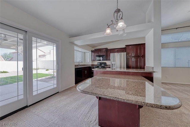 234 Geronimo Ct, Henderson, NV 89074 - kitchen featuring black appliances, light carpet, lofted ceiling, decorative light fixtures, and a chandelier