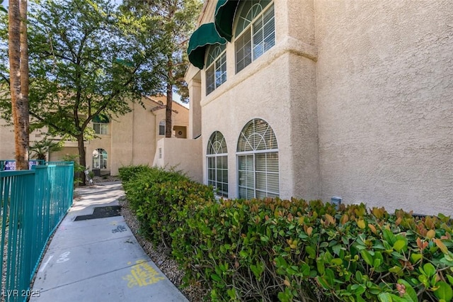 2251 Wigwam Pkwy Unit 824, Henderson, NV 89074 - view of side of property featuring stucco siding