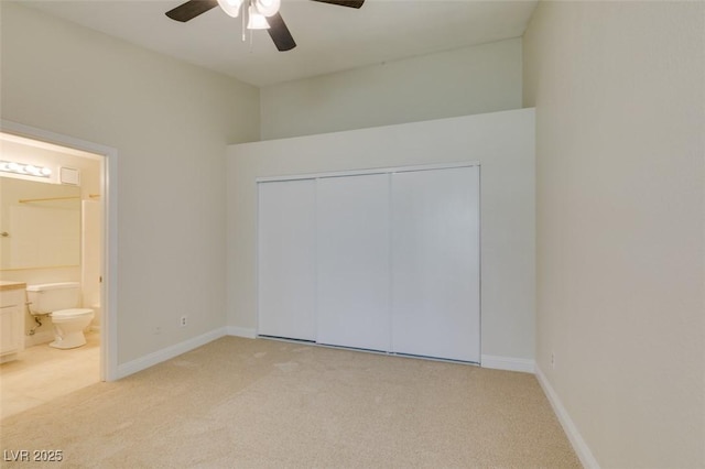 2251 Wigwam Pkwy Unit 824, Henderson, NV 89074 - unfurnished bedroom with light colored carpet, ensuite bath, baseboards, and a closet