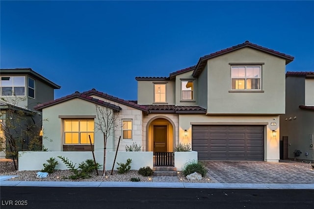 182 Robledo St, Las Vegas, NV 89138 - view of front of home featuring a tiled roof, a garage, stucco siding, and driveway