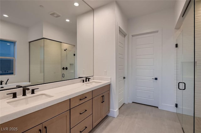 182 Robledo St, Las Vegas, NV 89138 - bathroom with double vanity, a shower stall, and recessed lighting
