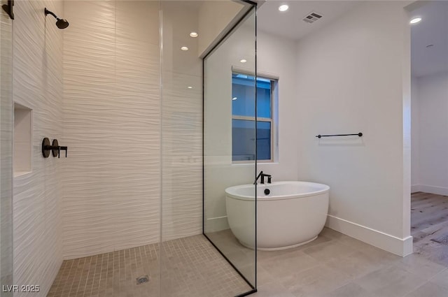 182 Robledo St, Las Vegas, NV 89138 - full bath with a tile shower, a freestanding tub, baseboards, and tile patterned floors