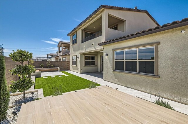 182 Robledo St, Las Vegas, NV 89138 - back of house with stucco siding, a balcony, and a tiled roof