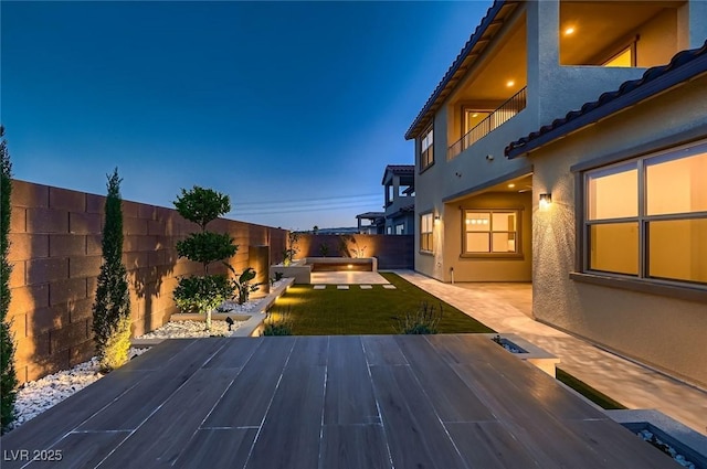 182 Robledo St, Las Vegas, NV 89138 - fenced backyard with a patio area