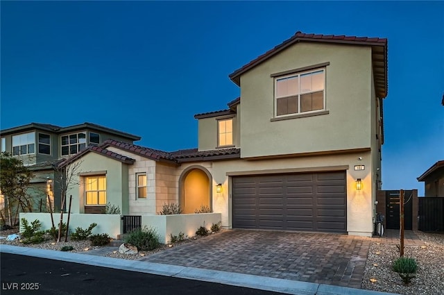 182 Robledo St, Las Vegas, NV 89138 - view of front of home featuring a tile roof, an attached garage, and stucco siding