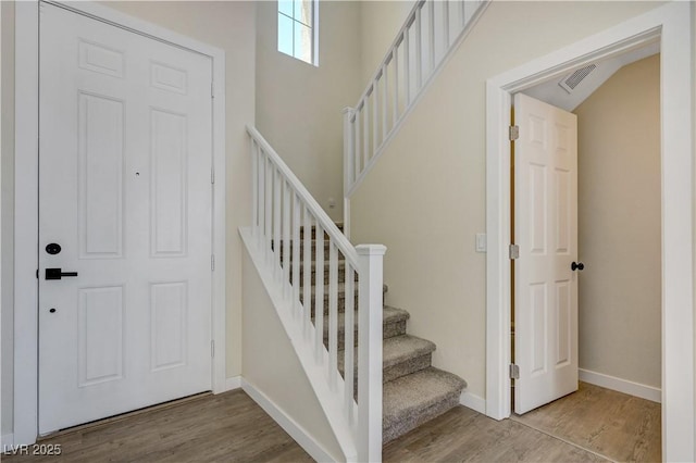 1952 W Hammer Ln, North Las Vegas, NV 89031 - entryway featuring wood finished floors, baseboards, and stairway