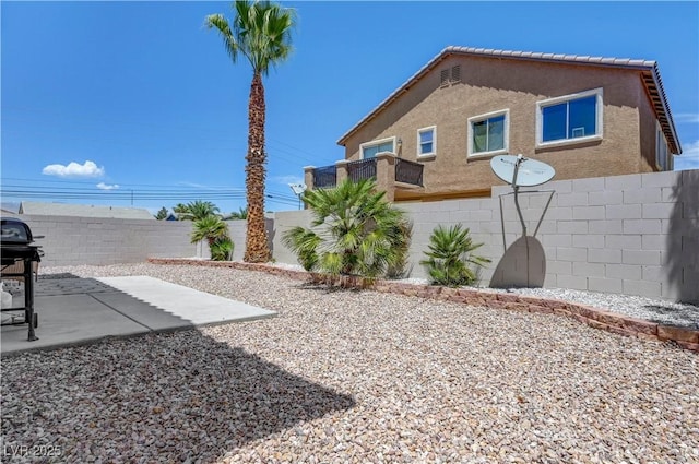 1952 W Hammer Ln, North Las Vegas, NV 89031 - fenced backyard with a patio