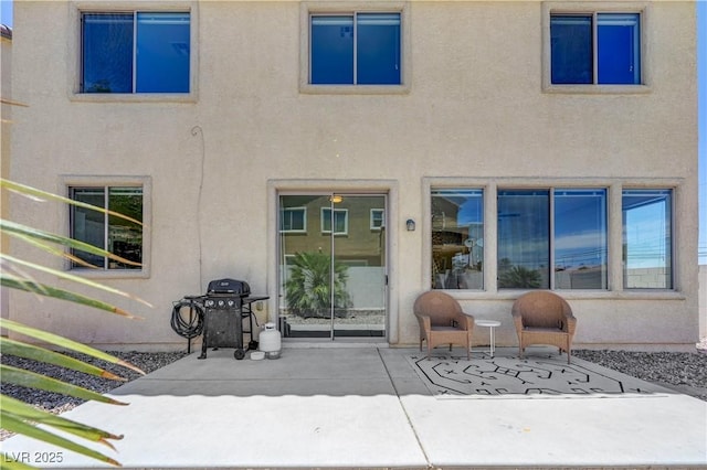 1952 W Hammer Ln, North Las Vegas, NV 89031 - rear view of house featuring a patio area and stucco siding