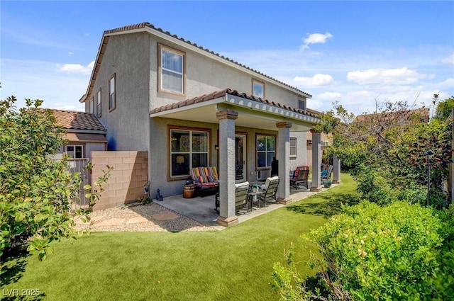 831 E Galingale Ct, Henderson, NV 89015 - back of property featuring stucco siding, a patio area, and a tiled roof