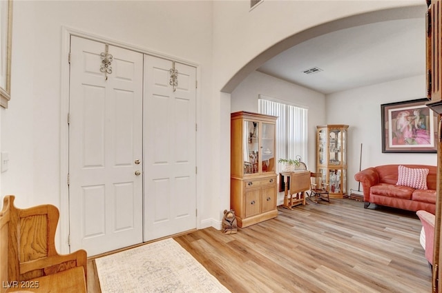 831 E Galingale Ct, Henderson, NV 89015 - foyer with arched walkways, light wood-style flooring, and baseboards