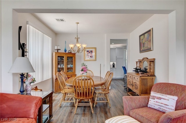 831 E Galingale Ct, Henderson, NV 89015 - dining space with a chandelier and dark wood-type flooring