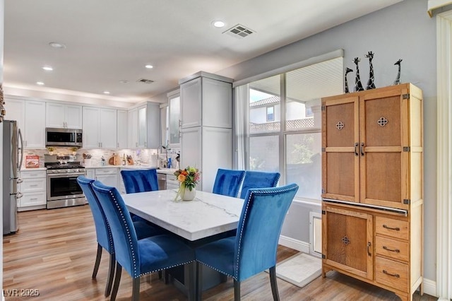 831 E Galingale Ct, Henderson, NV 89015 - dining room with light wood-style flooring and recessed lighting