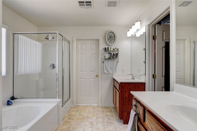 831 E Galingale Ct, Henderson, NV 89015 - full bath with a stall shower, two vanities, and a garden tub