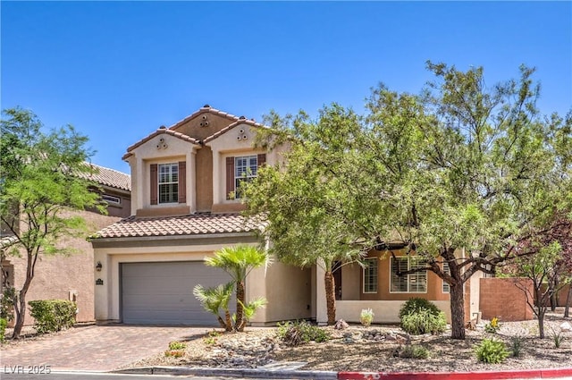 11625 Cabo Del Verde Ave, Las Vegas, NV 89138 - mediterranean / spanish-style house with a garage, a tile roof, stucco siding, and driveway