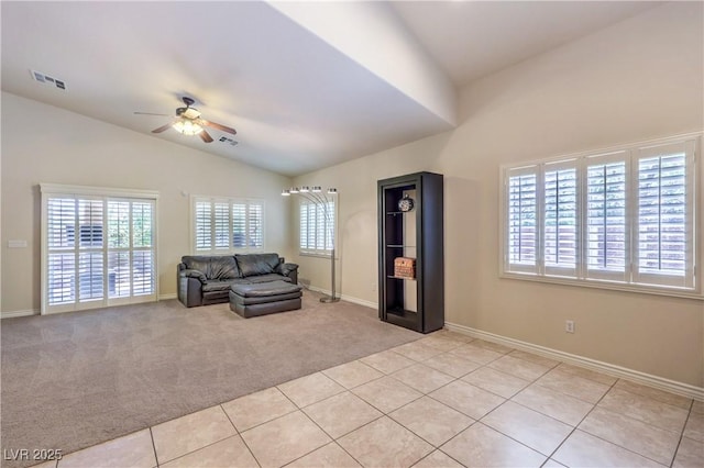 11625 Cabo Del Verde Ave, Las Vegas, NV 89138 - living area with ceiling fan, vaulted ceiling, light carpet, and light tile patterned flooring