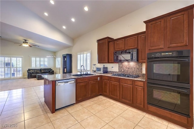11625 Cabo Del Verde Ave, Las Vegas, NV 89138 - kitchen featuring black appliances, healthy amount of natural light, a peninsula, recessed lighting, and light tile patterned floors