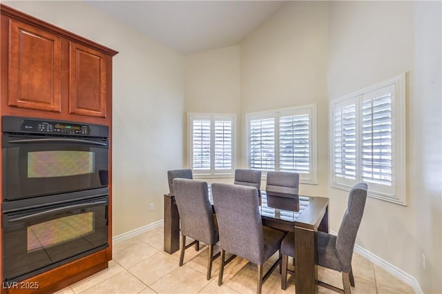 11625 Cabo Del Verde Ave, Las Vegas, NV 89138 - dining room with high vaulted ceiling and light tile patterned floors