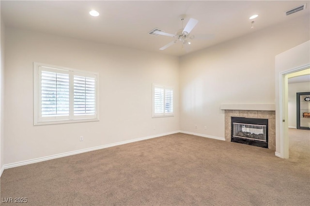 11625 Cabo Del Verde Ave, Las Vegas, NV 89138 - unfurnished living room featuring ceiling fan, carpet flooring, a tiled fireplace, and recessed lighting