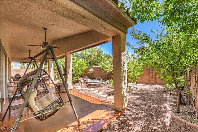11625 Cabo Del Verde Ave, Las Vegas, NV 89138 - fenced backyard with ceiling fan and a patio area