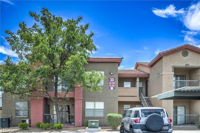 8000 Badura Ave Unit 1168, Las Vegas, NV 89113 - view of building exterior with cooling unit and stairs